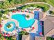 Resort-style pool with lounge chairs and umbrellas at 6870 Willowshire Way, Bradenton, FL 34212