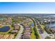 Wide aerial perspective showing the community's layout with lakes, trees, and orderly residential areas at 6870 Willowshire Way, Bradenton, FL 34212