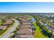 Aerial view of homes, lake, and landscape at 6870 Willowshire Way, Bradenton, FL 34212