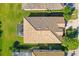 Top-down view of home with tile roof and pool at 6870 Willowshire Way, Bradenton, FL 34212