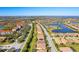 Aerial view of community with lake and homes at 6870 Willowshire Way, Bradenton, FL 34212