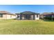 Large backyard with screened patio and lush lawn at 6870 Willowshire Way, Bradenton, FL 34212