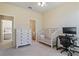 Bright bedroom with built-in dresser and workspace at 6870 Willowshire Way, Bradenton, FL 34212