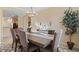 Formal dining room featuring a rustic wooden table and seating at 6870 Willowshire Way, Bradenton, FL 34212