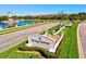 Heritage Harbour entrance sign with landscaping and water view at 6870 Willowshire Way, Bradenton, FL 34212