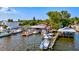 Aerial view of waterfront property with boats and docks at 6870 Willowshire Way, Bradenton, FL 34212