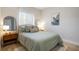 Bright bedroom with a double bed and wood nightstand at 3816 6Th Ave, Holmes Beach, FL 34217