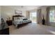 Main bedroom with king-size bed and access to balcony at 3816 6Th Ave, Holmes Beach, FL 34217