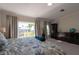 Main bedroom with king-size bed and private balcony at 3816 6Th Ave, Holmes Beach, FL 34217