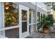 View of the patio and French doors from outside at 3816 6Th Ave, Holmes Beach, FL 34217