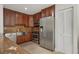 Modern kitchen featuring stainless steel appliances and dark wood cabinetry at 3816 6Th Ave, Holmes Beach, FL 34217