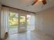 Laundry/Sunroom with backyard access and tile floors at 3816 6Th Ave, Holmes Beach, FL 34217