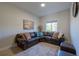 Relaxing living room with leather sectional and large window at 3816 6Th Ave, Holmes Beach, FL 34217