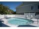 Inviting community pool with lounge chairs at 3816 6Th Ave, Holmes Beach, FL 34217