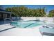 Community pool with ample lounge chairs at 3816 6Th Ave, Holmes Beach, FL 34217