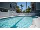 Community pool area with surrounding fence at 3816 6Th Ave, Holmes Beach, FL 34217