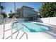 Inviting kidney-shaped pool with lounge chairs at 3816 6Th Ave, Holmes Beach, FL 34217