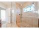 Large walk-in shower with glass enclosure and bench at 3816 6Th Ave, Holmes Beach, FL 34217