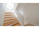 Elegant staircase with light wood steps at 3816 6Th Ave, Holmes Beach, FL 34217