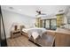 Bright bedroom with a king-size bed, wood floors, and large windows at 360 N Shore Dr, Sarasota, FL 34234