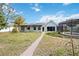 Backyard with home, garden, and solar panels at 510 Westlake Dr, Sarasota, FL 34232