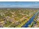 Wide aerial view of a community near a canal at 5271 Beckham St, North Port, FL 34288