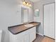 Bathroom with vanity, mirror and tile floor at 5271 Beckham St, North Port, FL 34288