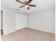 Bedroom with tile floors, ceiling fan and closet at 5271 Beckham St, North Port, FL 34288