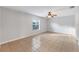 Spacious bedroom with tile flooring and ceiling fan at 5271 Beckham St, North Port, FL 34288