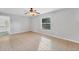 Bright bedroom with tile flooring and a large window at 5271 Beckham St, North Port, FL 34288