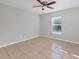 Spacious bedroom with tile floors and ceiling fan at 5271 Beckham St, North Port, FL 34288