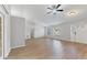 Bright living room with hardwood floors and ceiling fan at 5271 Beckham St, North Port, FL 34288