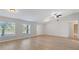 Open living room with hardwood floors and neutral walls at 5271 Beckham St, North Port, FL 34288