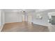 Bright living room featuring hardwood floors and access to the kitchen at 5271 Beckham St, North Port, FL 34288