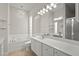 Elegant bathroom with soaking tub, double vanity and large mirror at 5762 Benevento Dr, Sarasota, FL 34238