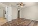 Bedroom with wood-look flooring and a ceiling fan at 5762 Benevento Dr, Sarasota, FL 34238