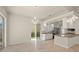 Bright dining area with access to the backyard and a modern chandelier at 5762 Benevento Dr, Sarasota, FL 34238