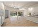 Spacious living area with high ceilings, tile floors, and access to backyard at 5762 Benevento Dr, Sarasota, FL 34238