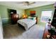 Bedroom with a full bed and a large dresser at 7315 8Th W Ave, Bradenton, FL 34209