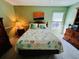 Bedroom with full bed, dresser, and ceiling fan at 7315 8Th W Ave, Bradenton, FL 34209