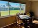 Dining area with wooden table and view to backyard at 7315 8Th W Ave, Bradenton, FL 34209