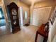 Home entryway with a grandfather clock and storage at 7315 8Th W Ave, Bradenton, FL 34209