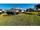 Side view of home showcasing landscaping and curb appeal at 7315 8Th W Ave, Bradenton, FL 34209