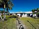 Front view of charming villa with landscaped lawn at 7315 8Th W Ave, Bradenton, FL 34209