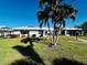 Front view of charming villa with lush lawn at 7315 8Th W Ave, Bradenton, FL 34209