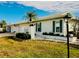 White single story home with attached garage and landscaped yard at 7315 8Th W Ave, Bradenton, FL 34209