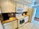 Modern kitchen with granite countertops and white appliances at 7315 8Th W Ave, Bradenton, FL 34209
