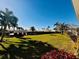 Landscaped lawn with tropical plants and trees at 7315 8Th W Ave, Bradenton, FL 34209
