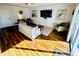 Spacious living room, hardwood floors, large TV at 7315 8Th W Ave, Bradenton, FL 34209