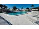 Community pool with lounge chairs and a shaded area at 7315 8Th W Ave, Bradenton, FL 34209